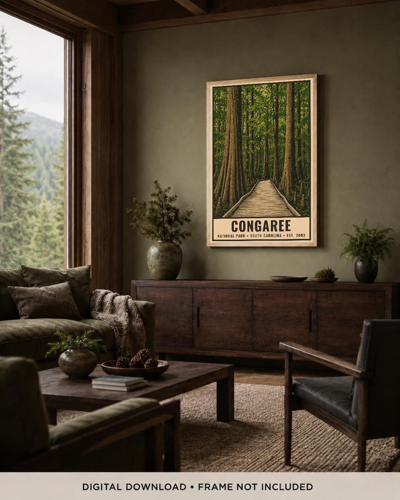 May include: A vertical rectangular wall art print featuring a forest scene with tall trees and a wooden boardwalk path. The text at the bottom reads CONGAREE NATIONAL PARK SOUTH CAROLINA EST. 2003. The print is displayed in a light wood frame.