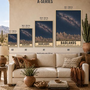 May include: Four vertical wall art prints labeled A3, A2, A1, and A0, each depicting the Badlands National Park under a starry night sky. Sizes range from 11.7 x 16.5 inches to 33.1 x 46.8 inches. The text reads Badlands National Park South Dakota.