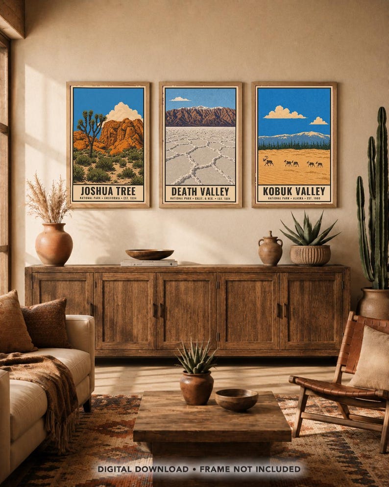 May include: Three rectangular wall art prints featuring illustrations of Joshua Tree, Death Valley, and Kobuk Valley National Parks. Each print displays a blue sky, landscape scenery, and the park name in black text at the bottom of the frame.