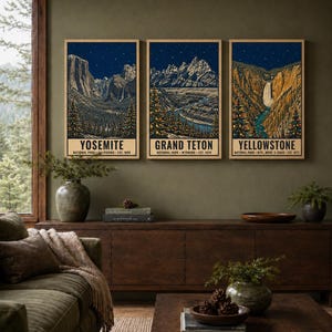 May include: A set of three vertical posters featuring illustrations of Yosemite, Grand Teton, and Yellowstone National Parks. Each print depicts a night landscape with starry skies, snow-capped mountains, and evergreen trees decorated with lights.