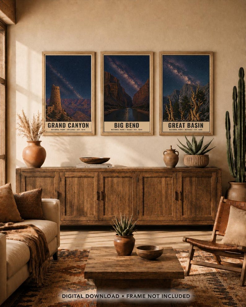 May include: Three vertical posters in wooden frames depicting the Grand Canyon, Big Bend, and Great Basin national parks under starry night skies. Each print features the park name, location, and establishment year at the bottom of the image.
