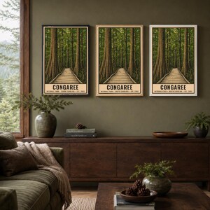 May include: Three identical vertical posters featuring a boardwalk path through a dense forest of tall trees. Each poster displays the text CONGAREE NATIONAL PARK SOUTH CAROLINA EST. 2003 at the bottom. The artwork uses shades of green and brown.