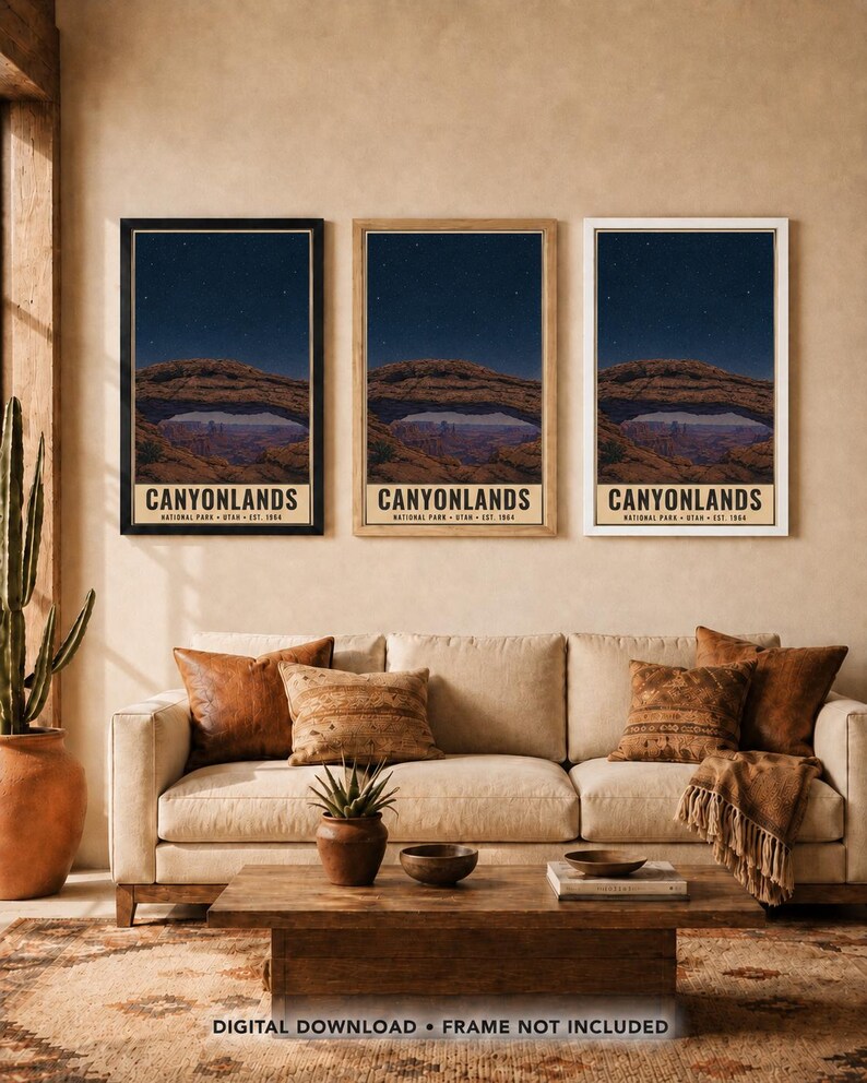 May include: Three vertical wall art prints featuring the Mesa Arch in Canyonlands National Park at night under a starry sky. Each print displays the text CANYONLANDS NATIONAL PARK UTAH EST. 1964. The prints are shown in black, wood, and white frames.