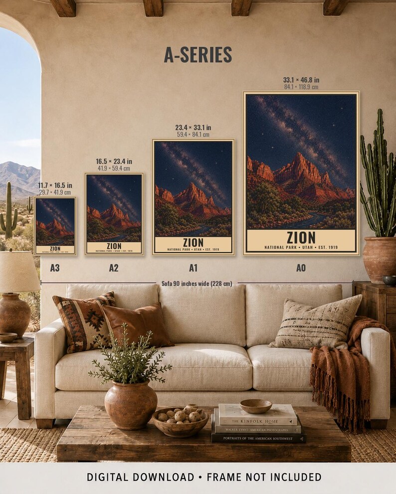 May include: Four framed wall art prints of Zion National Park displayed in A3, A2, A1, and A0 sizes above a sofa. Each print features a night sky with a milky way over red rock mountains and the text Zion National Park Utah Est. 1919.