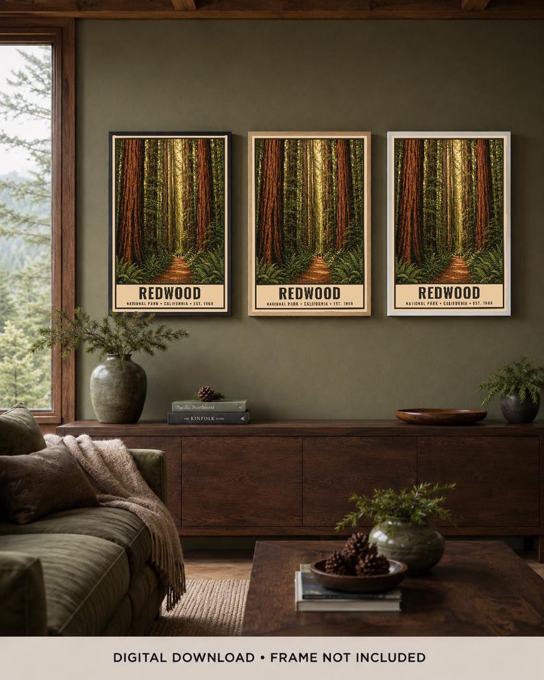 May include: Three vertical wall art prints featuring a Redwood National Park forest scene with tall trees and a dirt path. Each print includes the text REDWOOD NATIONAL PARK CALIFORNIA EST. 1968 at the bottom. The prints are displayed in black, wood, and white frames.