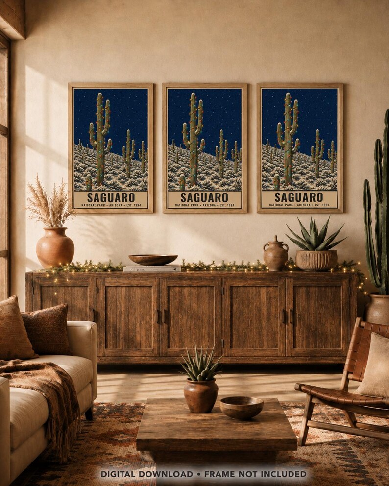 May include: A set of three identical wall art prints featuring a desert landscape with Saguaro cacti decorated with string lights under a starry night sky. Each print includes the text SAGUARO NATIONAL PARK ARIZONA EST. 1994 at the bottom.