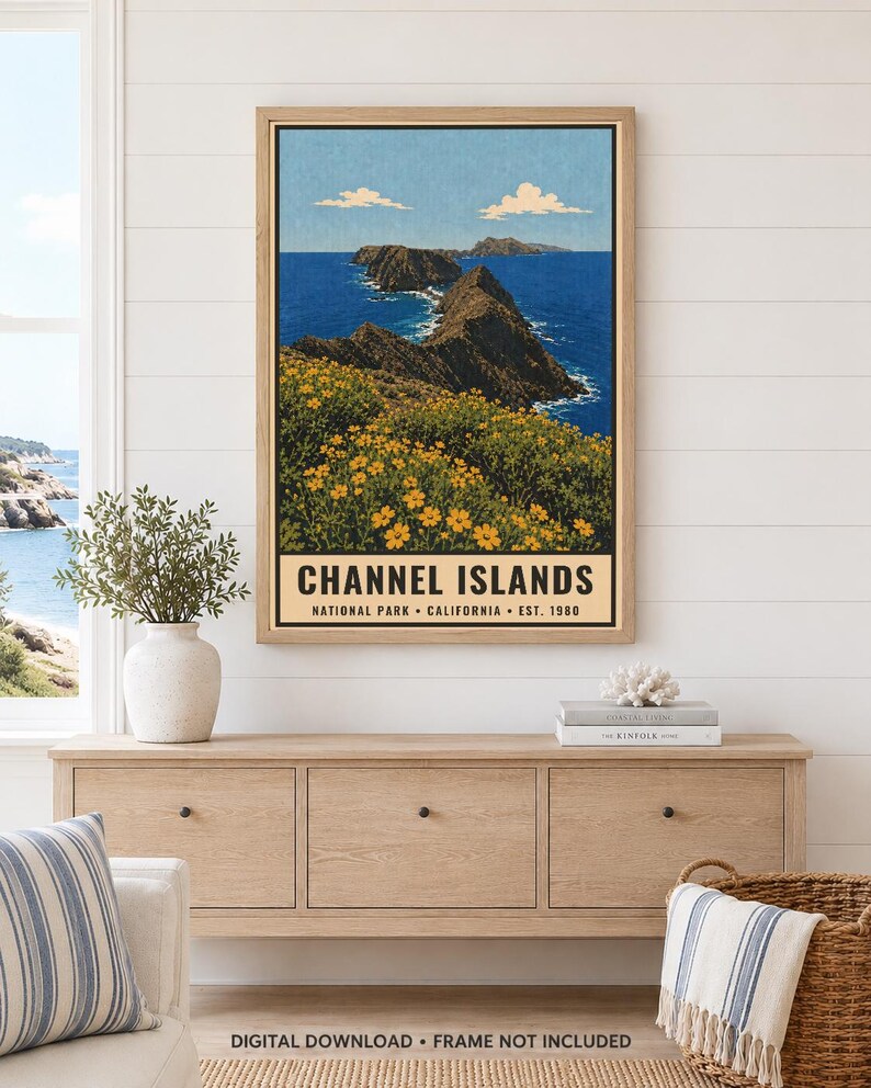 May include: A framed wall art print depicting a coastal landscape with yellow wildflowers in the foreground, rocky cliffs, and deep blue ocean water under a clear sky. The text reads CHANNEL ISLANDS NATIONAL PARK CALIFORNIA EST. 1980.
