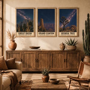 May include: Three vertical wall art prints featuring night sky landscapes of Great Basin, Grand Canyon, and Joshua Tree National Parks. Each print displays a starry galaxy above desert terrain with text identifying the park, state, and year established.