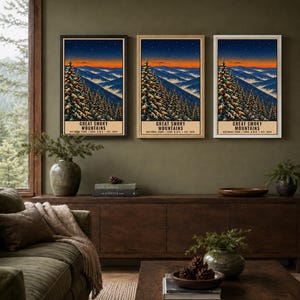 May include: Three identical vertical posters featuring a landscape illustration of the Great Smoky Mountains at sunset, with evergreen trees in the foreground, rolling blue mountains in the distance, and the text Great Smoky Mountains National Park.