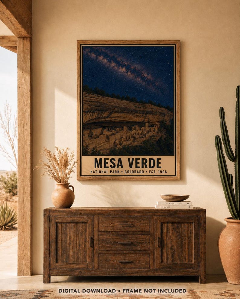 May include: A rectangular wall poster featuring a night sky filled with stars above the cliff dwellings of Mesa Verde National Park in Colorado. The text reads MESA VERDE NATIONAL PARK COLORADO EST. 1906 in bold black letters on a beige background.