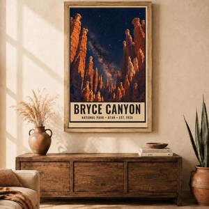 May include: A vertical rectangular wall art print featuring a night sky filled with stars above the orange rock formations of Bryce Canyon. The text at the bottom reads BRYCE CANYON NATIONAL PARK UTAH EST. 1928 in a bold, black sans-serif font.