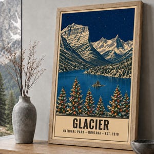 May include: A framed vertical poster featuring a night landscape of Glacier National Park, Montana. The artwork depicts snow-capped mountains, a dark blue lake, and evergreen trees decorated with colorful lights. Text reads GLACIER NATIONAL PARK MONTANA EST. 1910.
