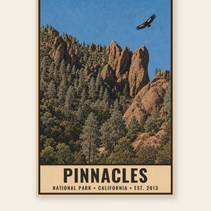 May include: A vertical poster featuring a landscape of Pinnacles National Park with jagged brown rock formations, green pine trees, and a bird flying in a blue sky. The text reads PINNACLES NATIONAL PARK CALIFORNIA EST. 2013 at the bottom.