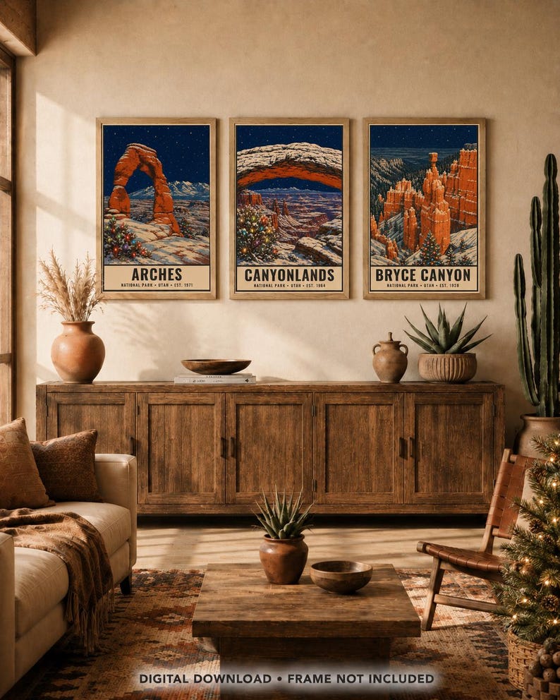 May include: Three framed wall art prints featuring illustrations of Arches, Canyonlands, and Bryce Canyon National Parks. Each print depicts a snowy landscape under a starry night sky with a decorated Christmas tree in the foreground.