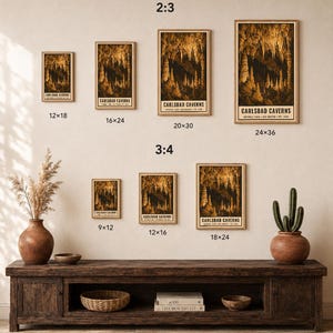 May include: A collection of seven framed posters depicting Carlsbad Caverns in various sizes, labelled 12x18, 16x24, 20x30, 24x36, 9x12, 12x16, and 18x24 inches. The posters feature golden-brown cave formations against a dark background with text.