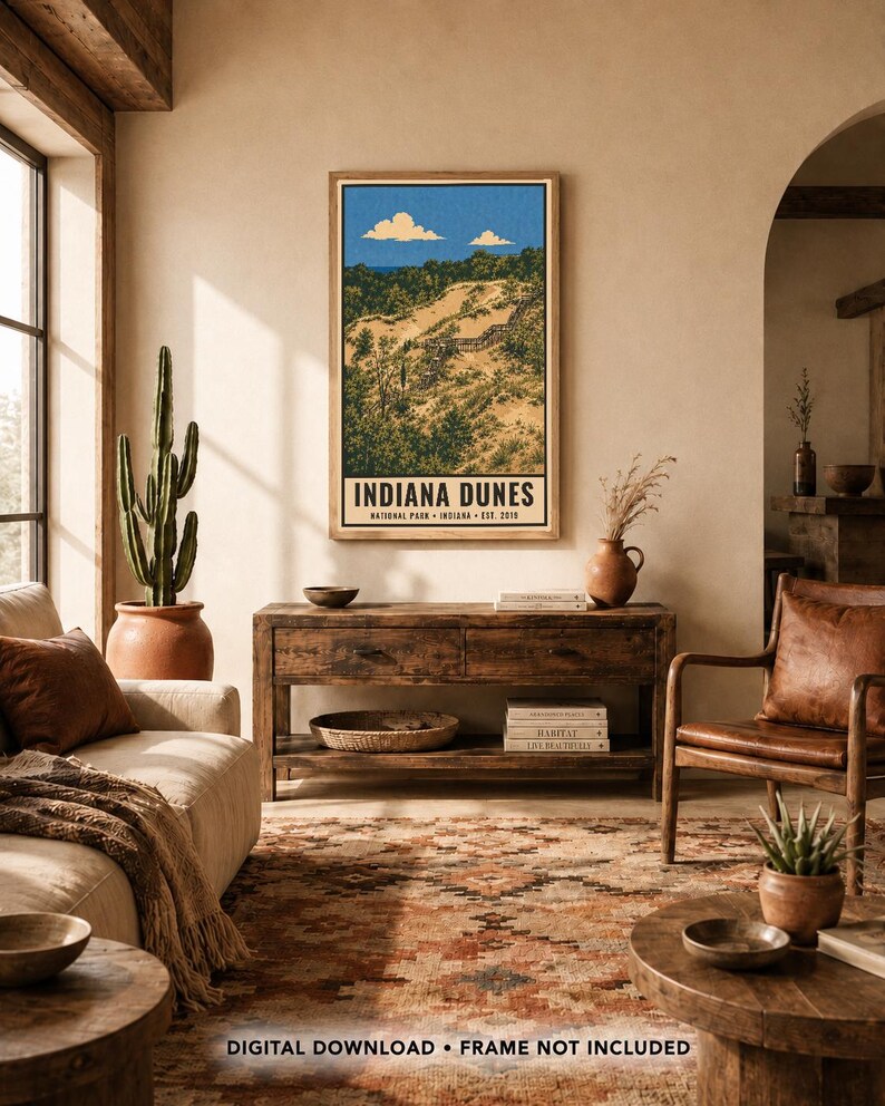 Op de afbeelding: Een verticale rechthoekige wandkunstprint met een landschapsillustratie van Indiana Dunes National Park met zandheuvels, groene bomen en een blauwe lucht met wolken. De tekst luidt INDIANA DUNES NATIONAL PARK INDIANA EST. 2019.