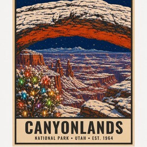 May include: A poster featuring a snowy landscape of Canyonlands National Park in Utah under a starry night sky. A large natural stone arch frames the view, while a snow-covered tree decorated with colorful lights stands in the foreground.