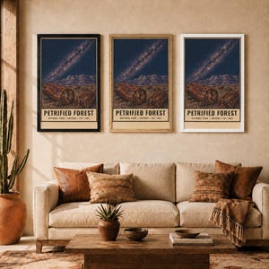 May include: Three vertical wall art prints featuring a night sky with a visible Milky Way galaxy over a desert landscape with petrified wood logs. Each print displays the text PETRIFIED FOREST NATIONAL PARK ARIZONA EST. 1962 in a cream border.