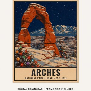 May include: A rectangular poster featuring a night scene of the red rock Delicate Arch in Arches National Park, Utah, under a starry sky with snow-covered ground and two evergreen trees decorated with colorful Christmas lights. Text reads ARCHES NATIONAL PARK UTAH EST. 1971.