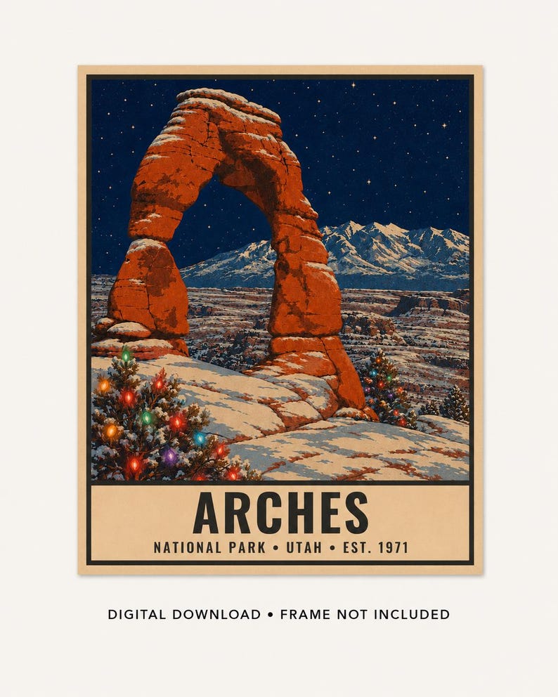May include: A rectangular poster featuring a night scene of the red rock Delicate Arch in Arches National Park, Utah, under a starry sky with snow-covered ground and two evergreen trees decorated with colorful Christmas lights. Text reads ARCHES NATIONAL PARK UTAH EST. 1971.