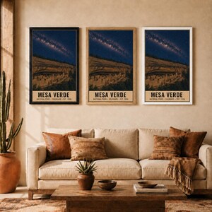 May include: Three vertical wall art prints featuring Mesa Verde National Park, Colorado, established 1906. Each print displays a night sky with a visible Milky Way over cliff dwellings, framed in black, light wood, and white frames respectively.