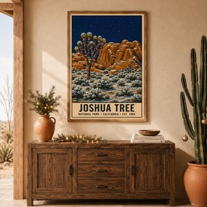 May include: A rectangular wall art print featuring a night landscape of Joshua Tree National Park with rock formations, desert vegetation, and a starry sky. The text at the bottom reads JOSHUA TREE NATIONAL PARK CALIFORNIA EST. 1994.
