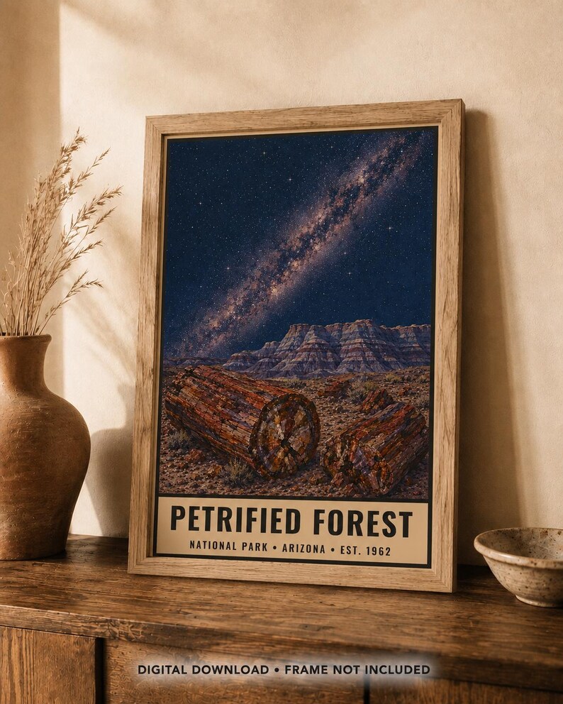 May include: A rectangular wall art print featuring a night sky with the Milky Way galaxy above a desert landscape with petrified wood logs. The bottom section contains the text PETRIFIED FOREST NATIONAL PARK ARIZONA EST. 1962 in black font.