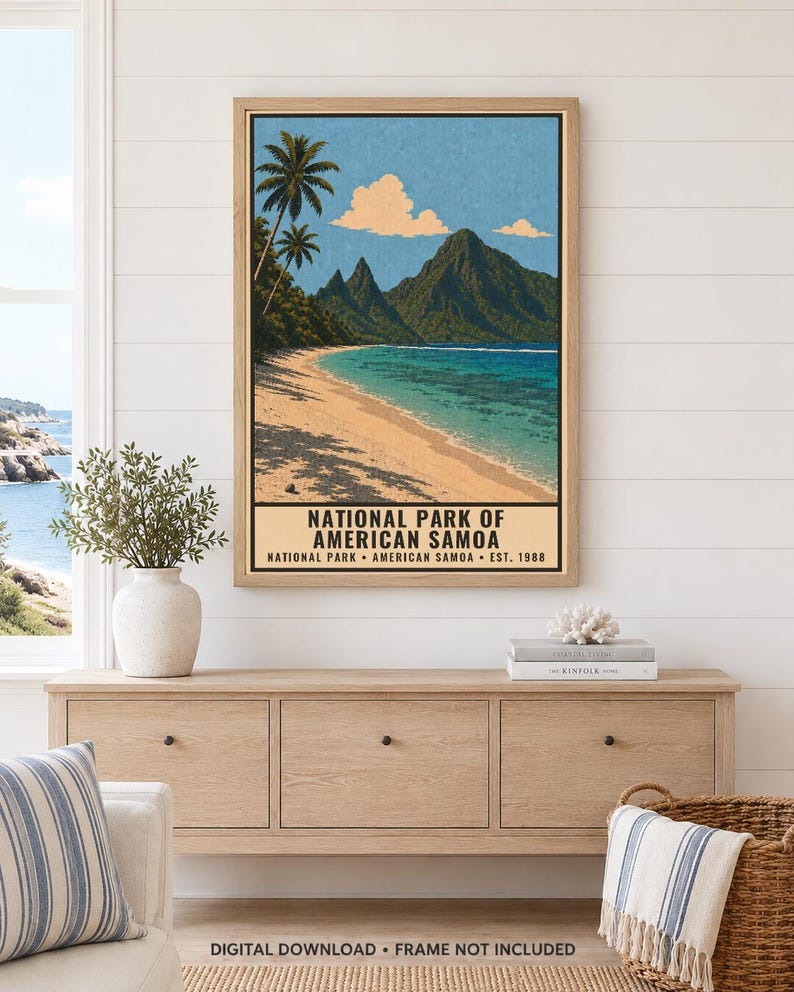 May include: A framed vertical poster depicting a tropical beach scene with palm trees, a sandy shore, turquoise water, and dark green mountains under a blue sky. The text reads NATIONAL PARK OF AMERICAN SAMOA NATIONAL PARK AMERICAN SAMOA EST. 1988.