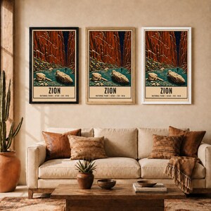 May include: Three identical vertical wall art prints depicting Zion National Park with red canyon walls, a blue river, and large rocks. Each print features the text ZION NATIONAL PARK UTAH EST. 1919 at the bottom, displayed in black, wood, and white frames.