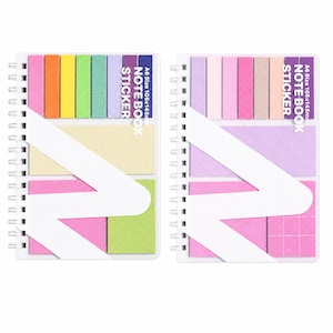 May include: Two A6 size 105x145mm spiral-bound notebooks featuring colorful adhesive sticky notes. The left notebook has rainbow-colored tabs, while the right has pink and purple tones. Both include a white diagonal paper band with text.