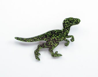 Broche dinosaure rapace scintillant