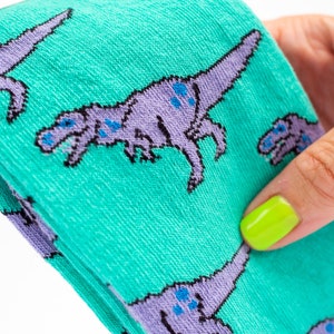 T-Rex dinosaur socks turquoise and lilac pair of socks image 2