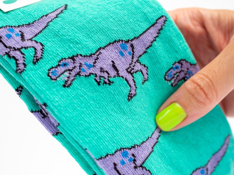 T-Rex dinosaur socks turquoise and lilac pair of socks image 2