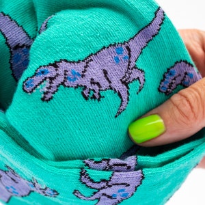 T-Rex dinosaur socks turquoise and lilac pair of socks image 3
