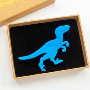 Raptor dinosaur brooch