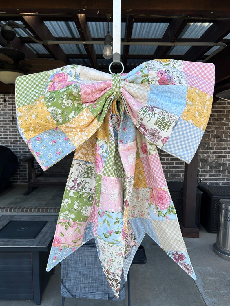 Large patchwork quilted bow with reversible green gingham back