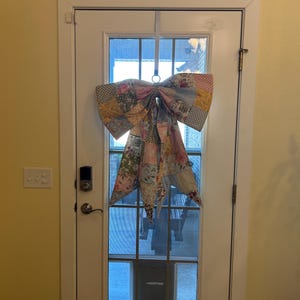 Reference to size hanging on a door.