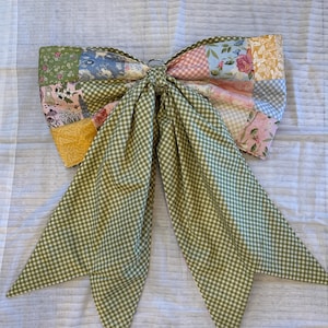 Back of the bow showing the green gingham fabric. The patchwork can be turned to the inside leaving the whole bow in the gingham pattern.