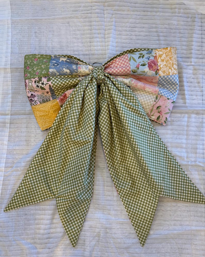 Back of the bow showing the green gingham fabric. The patchwork can be turned to the inside leaving the whole bow in the gingham pattern.