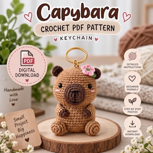 May include: A crochet capybara keychain with a brown body, dark brown snout, and a small pink flower on its head. The image includes text: Capybara CROCHET PDF PATTERN KEYCHAIN, DIGITAL DOWNLOAD, Detailed Instructions, Beginner Friendly, Step by Step Photos, Instant Download, Small Project Big Happiness.