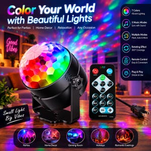 May include: A black LED disco ball light with a multi-colored faceted dome, accompanied by a black remote control featuring buttons for music modes, flash, and speed settings. The device includes a power cord and an adjustable mounting bracket.
