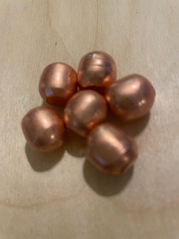 Copper:  Six Solid Spheres of Copper