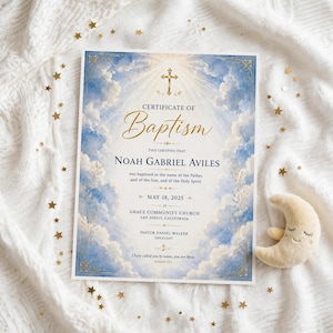 May include: A rectangular baptism certificate featuring a blue sky and white cloud background with a gold cross at the top. The text reads Certificate of Baptism, Noah Gabriel Aviles, May 18, 2025, Grace Community Church, San Diego, California.
