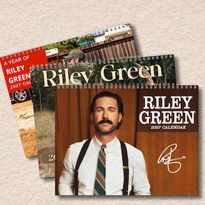 May include: Three spiral-bound wall calendars featuring Riley Green. The front calendar shows a man with a mustache wearing a white shirt, striped tie, and suspenders against a brown curtain, with the text Riley Green 2027 Calendar and a signature.