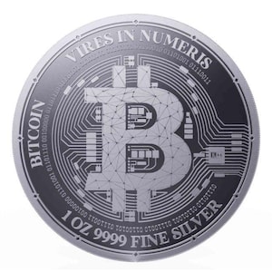May include: A circular silver coin featuring a central Bitcoin logo with a geometric circuit board pattern. The text reads BITCOIN, VIRES IN NUMERIS, and 1 OZ 9999 FINE SILVER, surrounded by binary code sequences etched into the metallic surface.