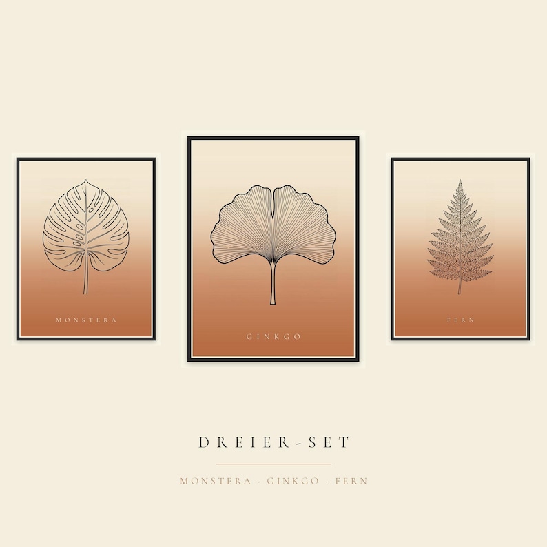May include: A set of three rectangular wall art prints in black frames, featuring line art of a monstera leaf, a ginkgo leaf, and a fern leaf. Each print has a gradient background transitioning from cream to terracotta. Text includes MONSTERA, GINKGO, FERN, and DREIER-SET.