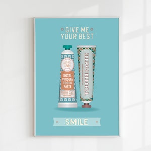 May include: A turquoise blue poster with the text "Give me your best" and "Smile" in white. Two vintage-style toothpaste tubes are shown in the center of the poster. The tube on the left is labeled "Royal Vinolia Tooth Paste" and the tube on the right is labeled "Toothpaste".