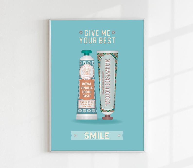 May include: A turquoise blue poster with the text "Give me your best" and "Smile" in white. Two vintage-style toothpaste tubes are shown in the center of the poster. The tube on the left is labeled "Royal Vinolia Tooth Paste" and the tube on the right is labeled "Toothpaste".