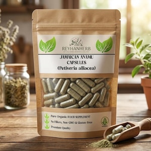 Könnte beinhalten: Ein brauner Kraftpapierbeutel mit jamaikanischen Anamu-Kapseln, beschriftet mit dem Markennamen Reyhanherb, dem Produktnamen sowie dem Text Pure Organic Food Supplement, No Fillers, Non-GMO & Gluten-free und Premium Quality.