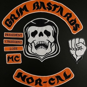 May include: A set of embroidered patches featuring an orange and black arched top rocker with the text GRIM BASTARDS, a central skull emblem, a bottom rocker with NOR-CAL, a fist patch, and rectangular patches labelled PRESIDENT, V.PRESIDENT, LODI, and MC.